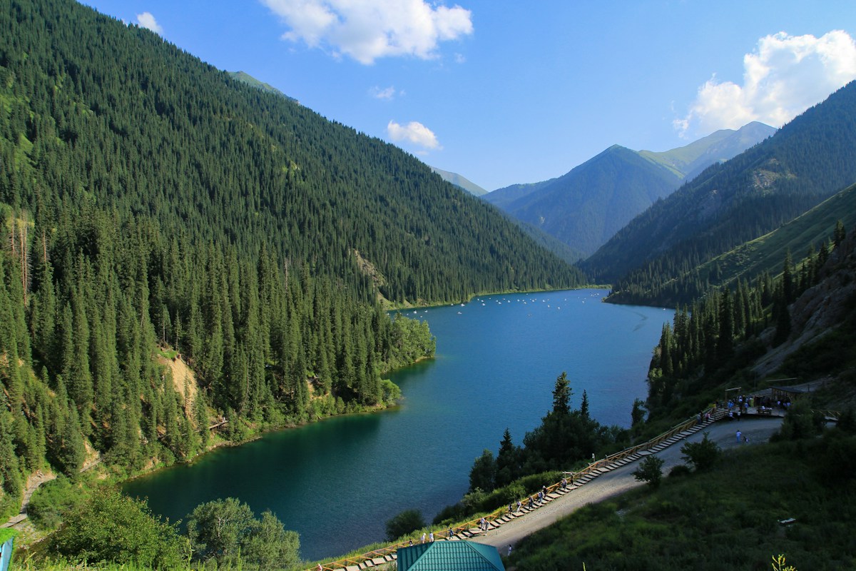 A mountain lake surrounded by fir forests in Kazakhstan